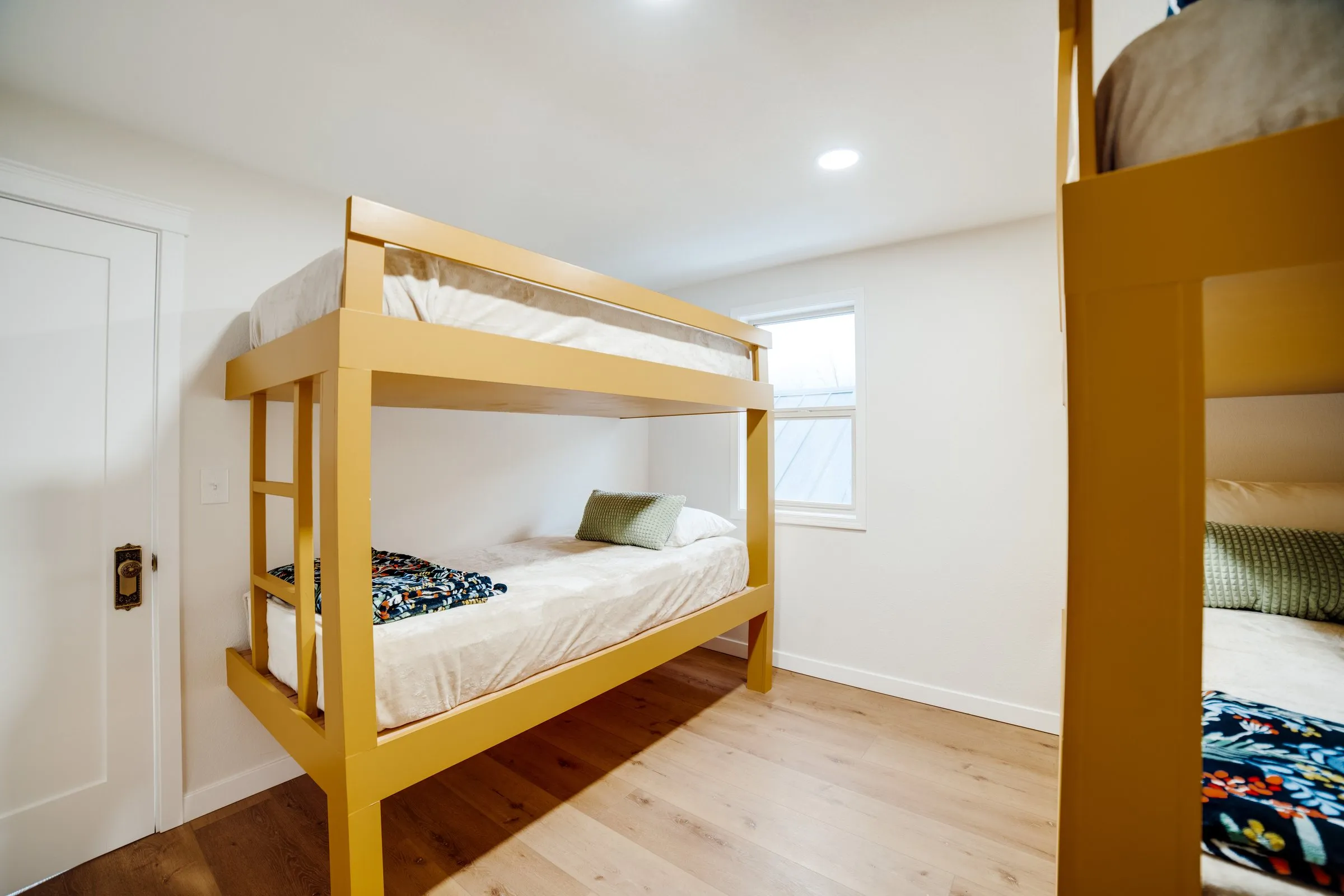 Twin-over-twin bunks in the kids’ bunk room