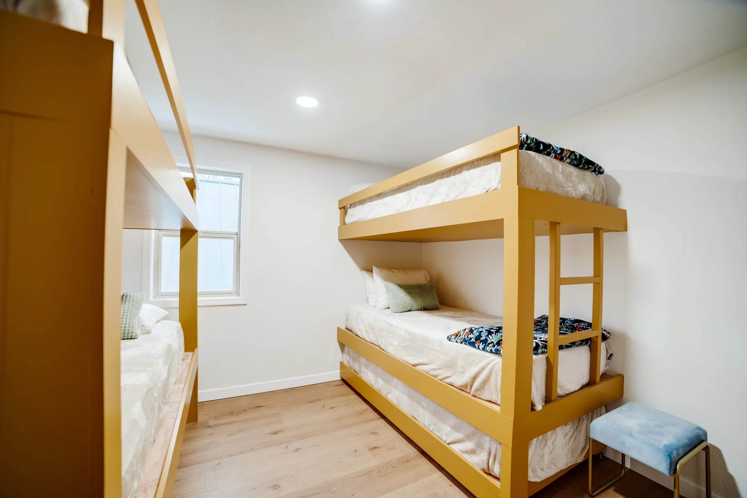 Bunk room with custom wood twin bunk beds