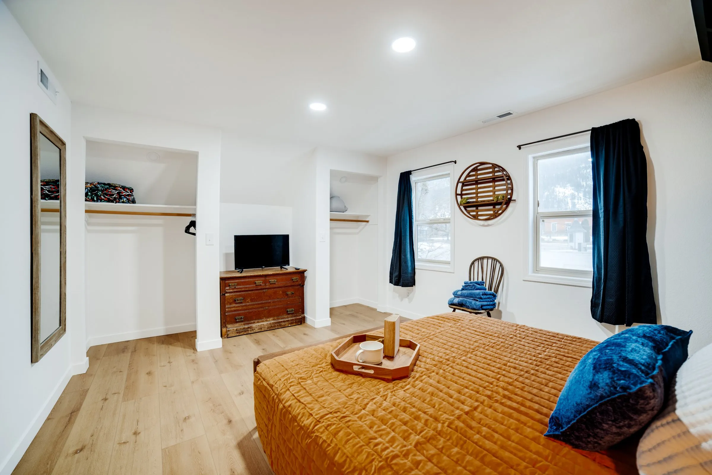 Upstairs bedroom with closets, TV and dresser